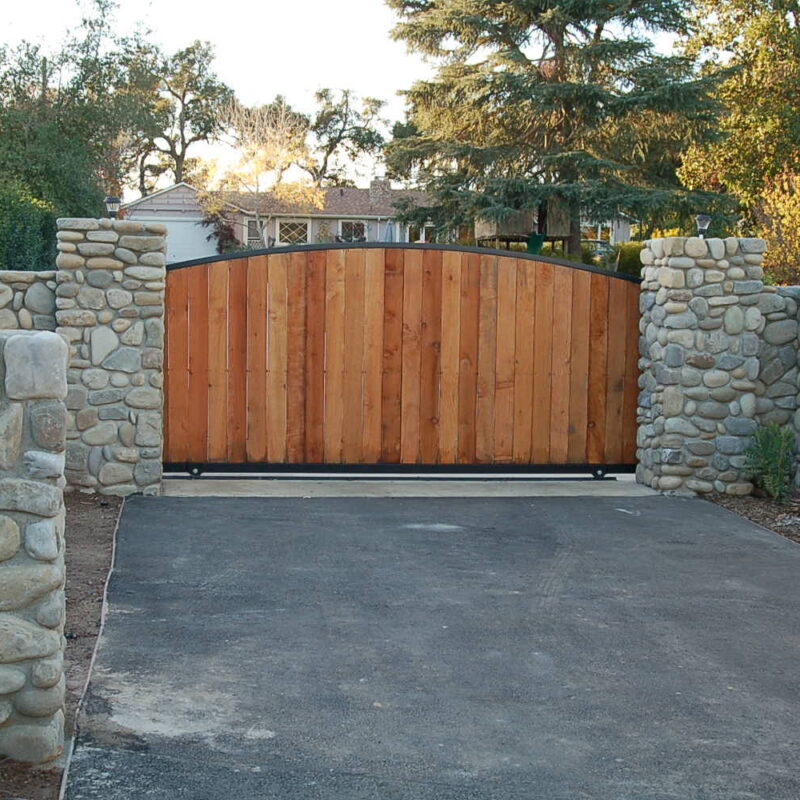 arched-wood-slide-gate-river-rock arched-wood-slide-gate-river-rock