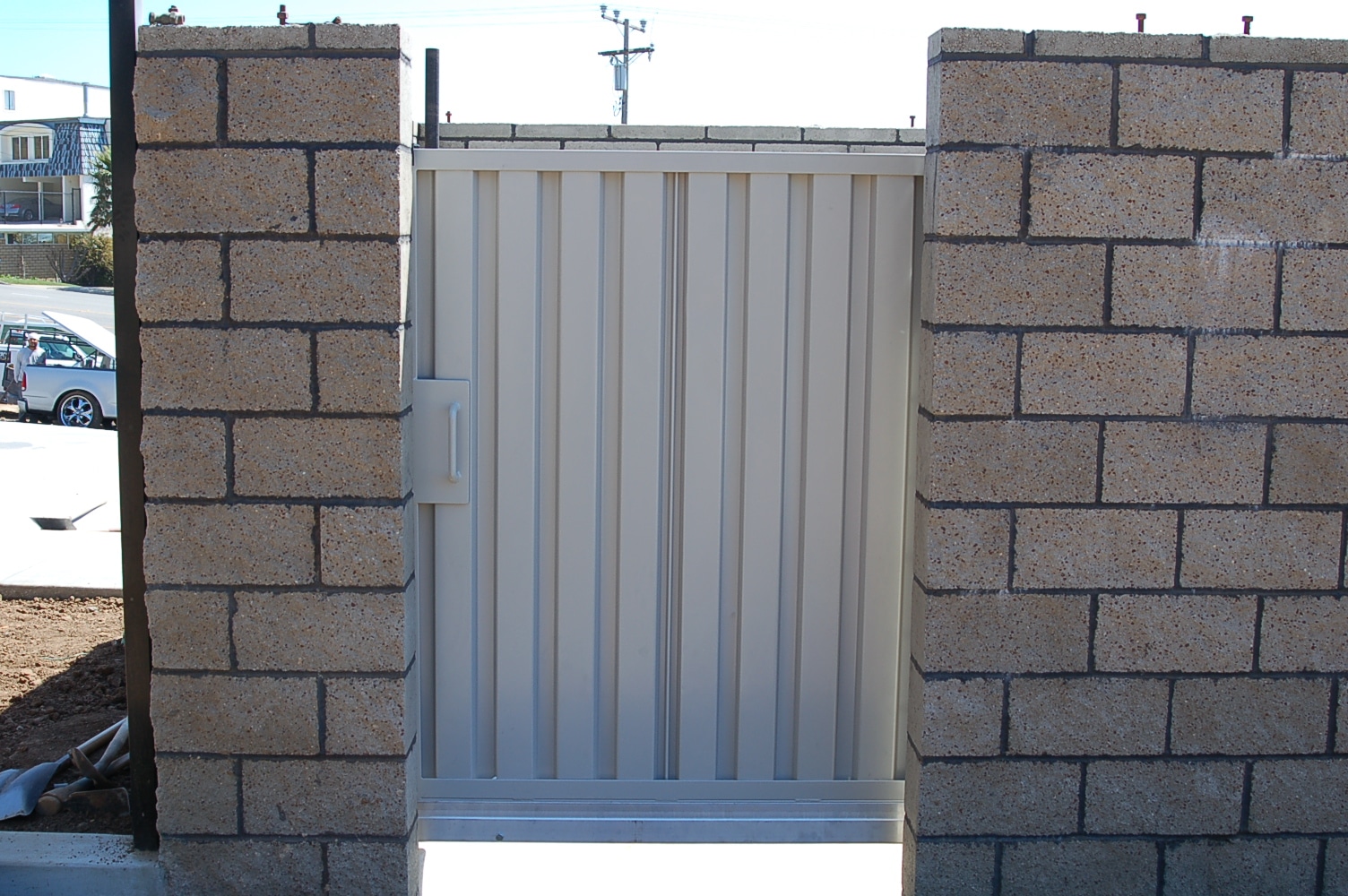 steel-pedestrian-gate-block-wall